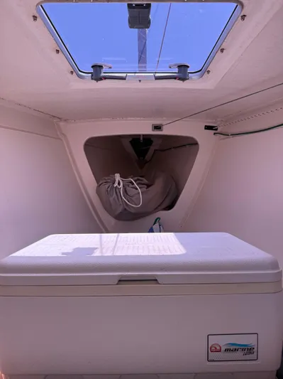 Bolero Yacht Photos Pics Interior of a 2012 Morris M29 sailboat with a storage compartment and hatch.