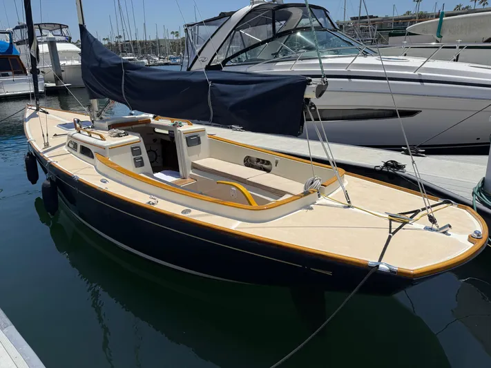 Bolero Yacht Photos Pics 2012 Morris M29 sailboat docked at marina, featuring sleek design and covered cockpit.