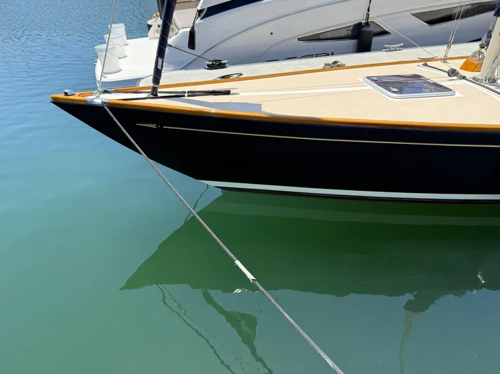 Bolero Yacht Photos Pics Sleek Morris M29 sailboat docked on calm water, 2012 model.