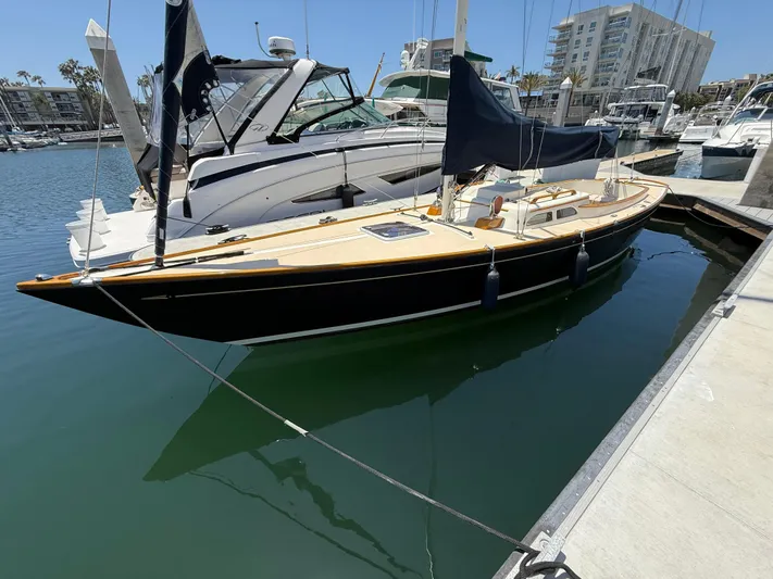 Bolero Yacht Photos Pics Sleek 2012 Morris M29 sailboat docked in a sunny marina.