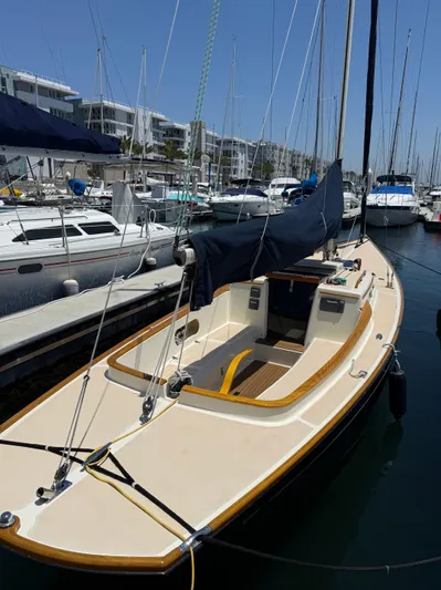 Bolero Yacht Photos Pics Sailboat Morris M29, 2012 model, docked in a marina with other boats.