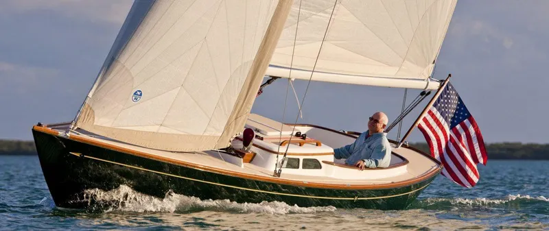 Bolero Yacht Photos Pics Sailing on a 2012 Morris M29 boat with American flag in open waters.