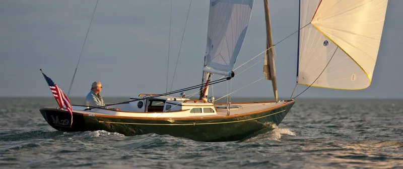Bolero Yacht Photos Pics Sailing boat Morris M29, 2012 model, on open water with American flag.