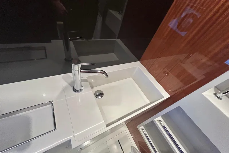  Yacht Photos Pics Luxurious bathroom sink in 2024 Riva 56 Rivale yacht, featuring sleek modern design.