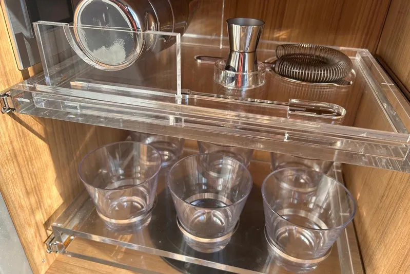  Yacht Photos Pics Barware set in a 2024 Riva 56 RIVALE yacht, featuring glasses and cocktail tools.