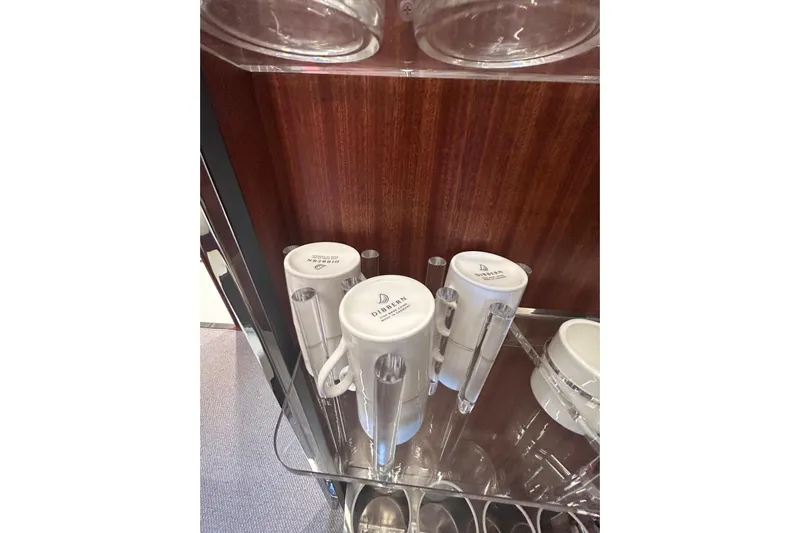  Yacht Photos Pics Cups and glasses in a wooden cabinet on a 2024 Riva 56 Rivale yacht.