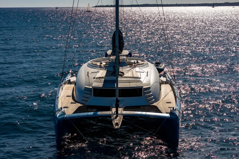 Lyfe At Sea Yacht Photos Pics Luxury Magic Yachts Custom 2015 catamaran sailing on sparkling ocean waters.