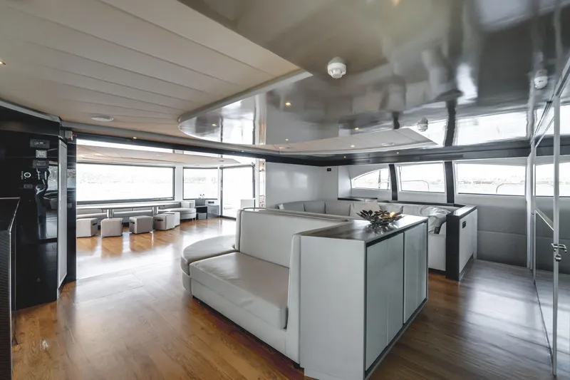 Lyfe At Sea Yacht Photos Pics Luxurious interior of 2015 Magic Yachts Custom model with modern seating and panoramic windows.