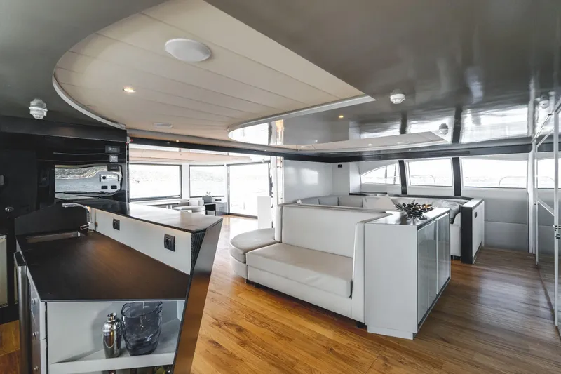 Lyfe At Sea Yacht Photos Pics Luxurious 2015 Magic Yachts Custom interior with modern design, featuring sleek furnishings and wooden flooring.