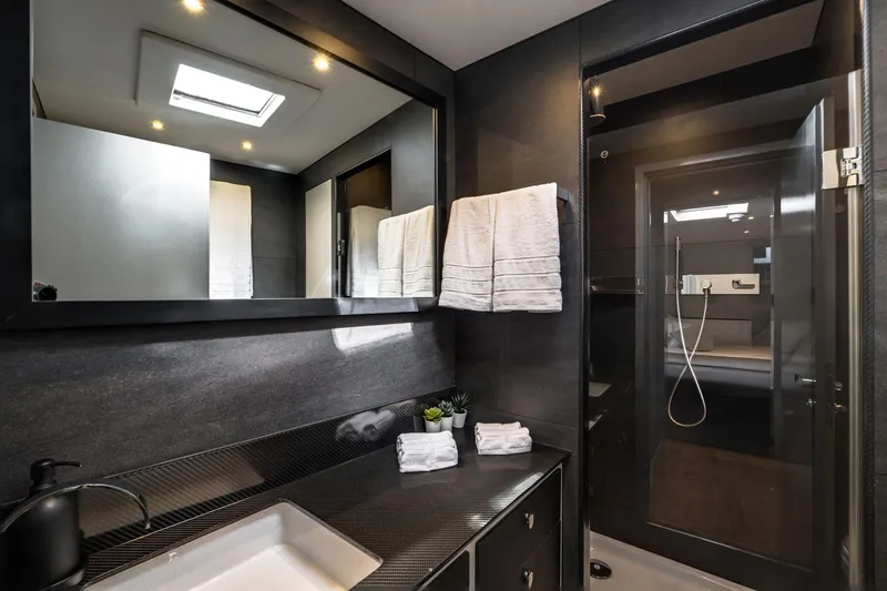 Lyfe At Sea Yacht Photos Pics Luxurious yacht bathroom with modern design, featuring sleek fixtures and elegant lighting. Magic Yachts Custom 2015.