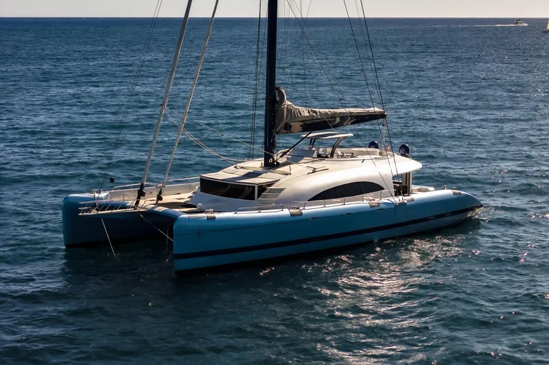 Lyfe At Sea Yacht Photos Pics Sleek 2015 Magic Yachts Custom catamaran sailing on open sea.