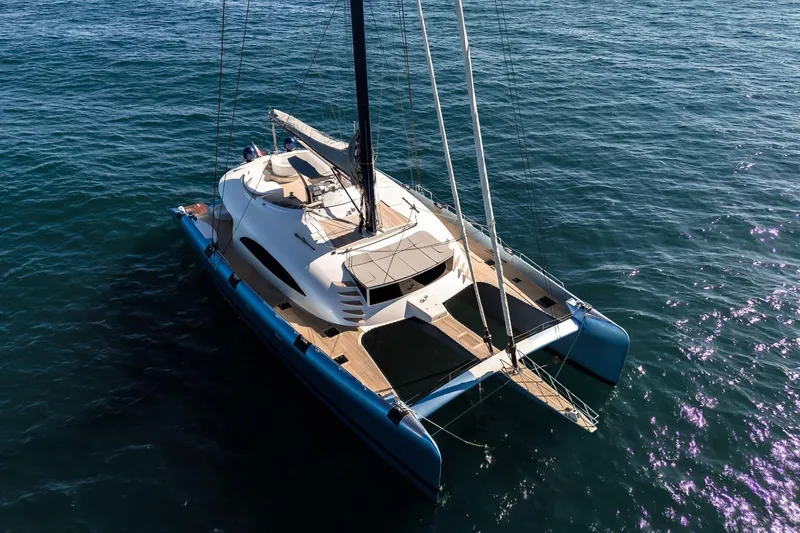 Lyfe At Sea Yacht Photos Pics Luxurious 2015 Magic Yachts Custom catamaran sailing on open sea.