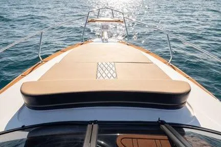 Ready For Delivery! Yacht Photos Pics 2026 Hanover 305 White and Black Premium Edition yacht on open water, sunlit deck view.