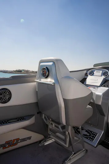  Yacht Photos Pics 2017 Cigarette 50 Marauder boat cockpit with modern controls and seating.