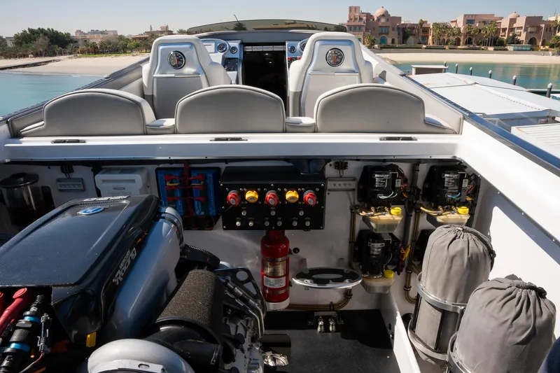  Yacht Photos Pics 2017 Cigarette 50 Marauder boat interior with engine and control panel.