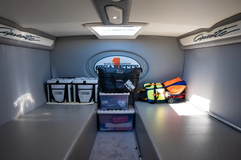  Yacht Photos Pics Interior cabin of a 2017 Cigarette 50 Marauder boat with storage and gear.