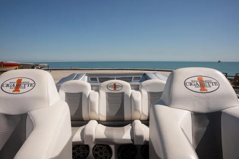  Yacht Photos Pics 2017 Cigarette 50 Marauder boat interior with white seats, ocean view in background.