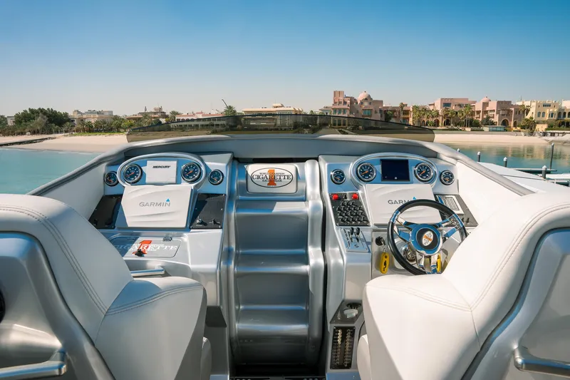  Yacht Photos Pics 2017 Cigarette 50 Marauder boat cockpit with advanced navigation systems and luxurious seating.