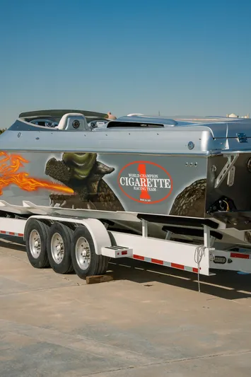  Yacht Photos Pics 2017 Cigarette 50 Marauder speedboat on a trailer with custom graphics.