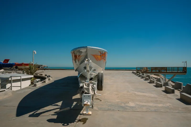  Yacht Photos Pics 2017 Cigarette 50 Marauder boat on a concrete dock under a clear blue sky.