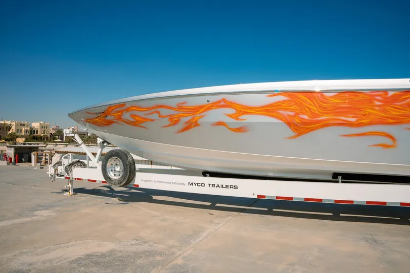  Yacht Photos Pics 2017 Cigarette 50 Marauder boat with flame graphics on trailer.