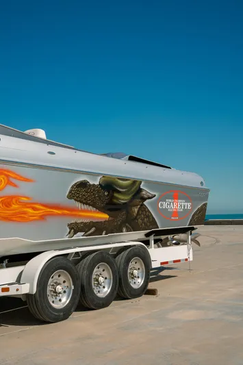  Yacht Photos Pics 2017 Cigarette 50 Marauder speedboat on a trailer with custom graphics.