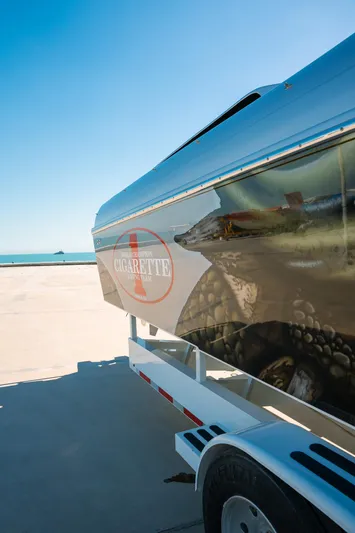  Yacht Photos Pics 2017 Cigarette 50 Marauder boat on trailer, parked near the ocean.