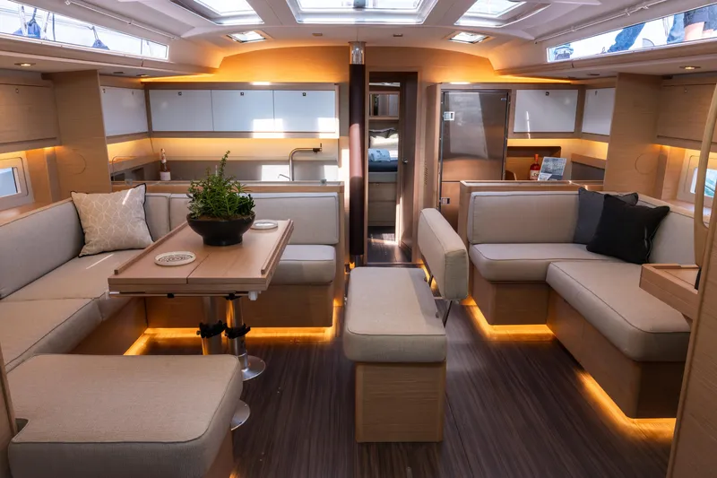 Yacht Photos Pics Luxurious interior of 2024 Dufour 530 yacht with modern seating and ambient lighting.