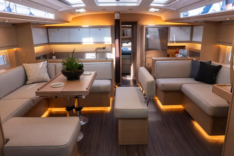  Yacht Photos Pics Luxurious interior of 2024 Dufour 530 yacht with modern furnishings and ambient lighting.