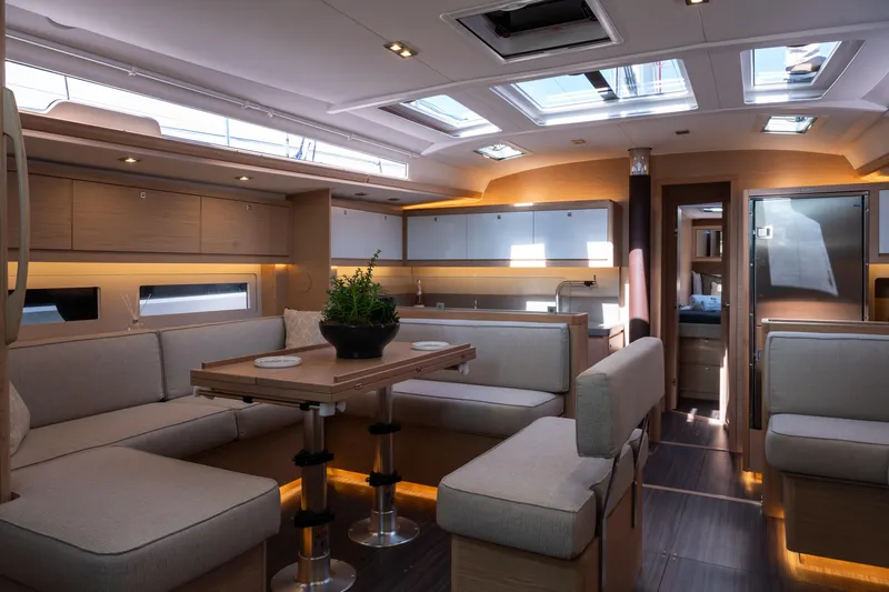  Yacht Photos Pics Luxurious interior of 2024 Dufour 530 yacht with modern seating and skylights.
