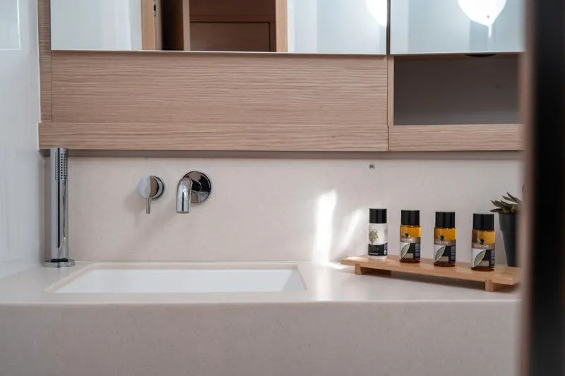  Yacht Photos Pics Modern bathroom sink with toiletries on Dufour 530 yacht, 2024 model.