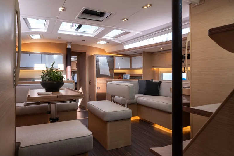  Yacht Photos Pics Luxurious interior of 2024 Dufour 530 yacht with modern furnishings and ambient lighting.