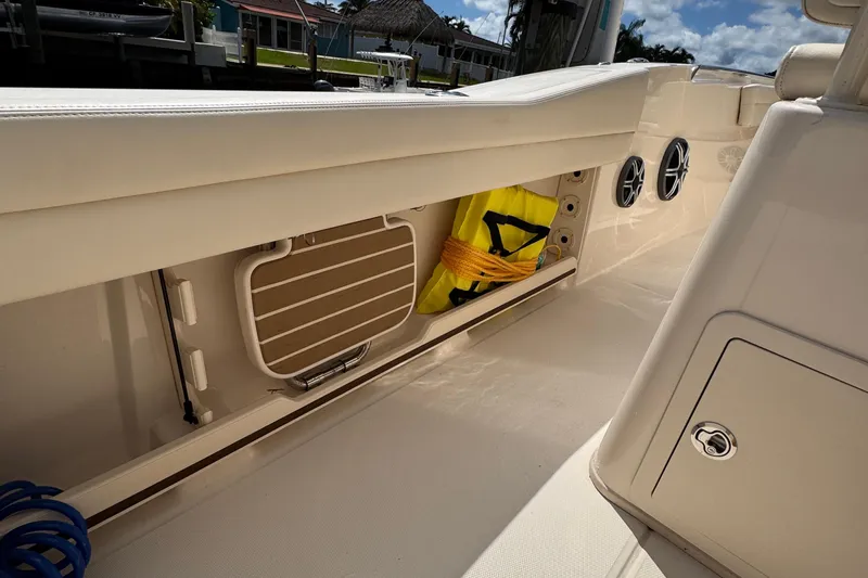  Yacht Photos Pics 2024 Grady-White Fisherman 236 boat interior with storage compartment and speakers.