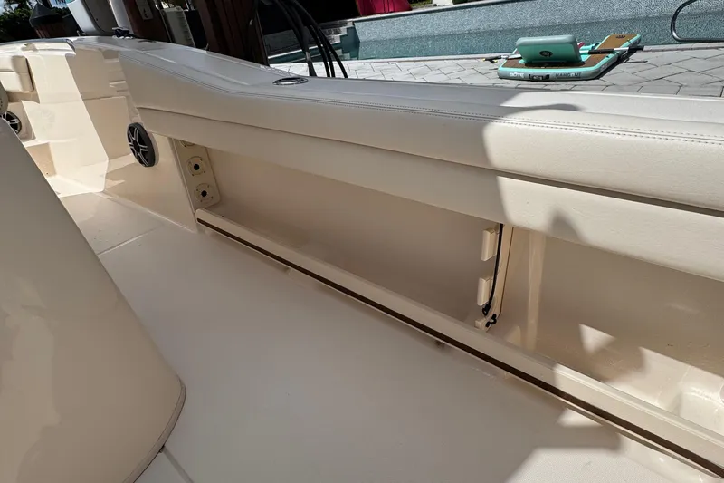  Yacht Photos Pics 2024 Grady-White Fisherman 236 boat interior with seating and storage compartments.