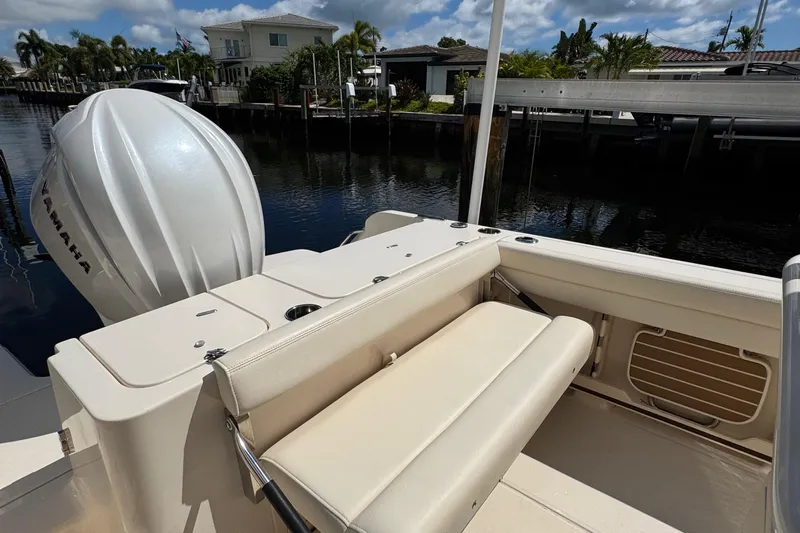  Yacht Photos Pics 2024 Grady-White Fisherman 236 boat with Yamaha engine, docked by waterfront homes.