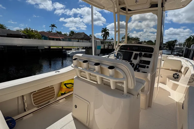  Yacht Photos Pics 2024 Grady-White Fisherman 236 boat interior with helm, rod holders, and seating.