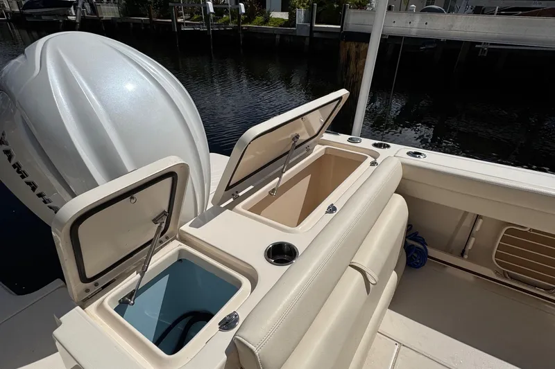  Yacht Photos Pics 2024 Grady-White Fisherman 236 boat with open storage compartments and Yamaha engine.