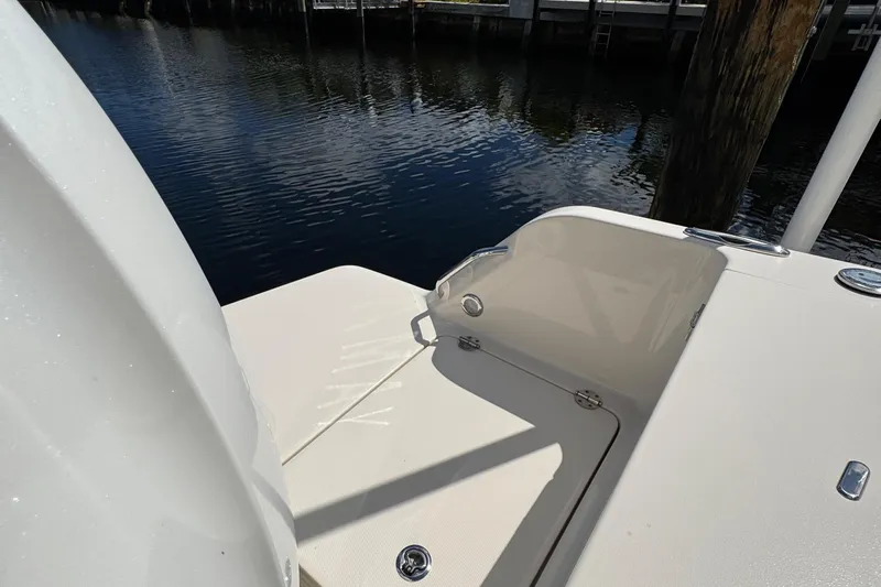  Yacht Photos Pics 2024 Grady-White Fisherman 236 boat deck near water, showcasing sleek design and craftsmanship.