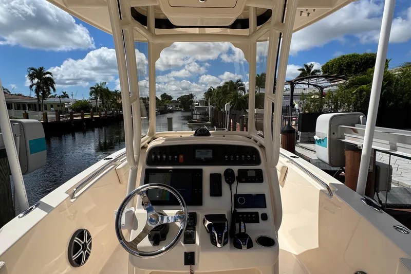  Yacht Photos Pics 2024 Grady-White Fisherman 236 boat cockpit with steering wheel and control panel.