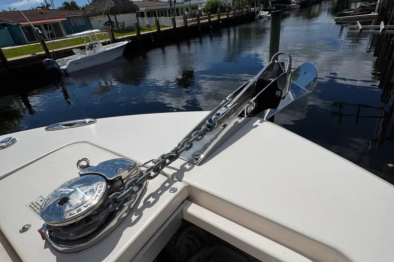  Yacht Photos Pics 2024 Grady-White Fisherman 236 boat anchor and chain on deck by a canal.