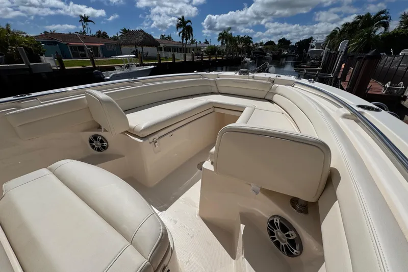  Yacht Photos Pics 2024 Grady-White Fisherman 236 boat interior with cushioned seating and speakers.