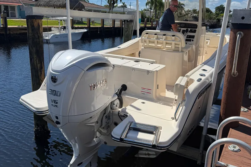  Yacht Photos Pics 2024 Grady-White Fisherman 236 boat with Yamaha 300 V6 engine docked by water.