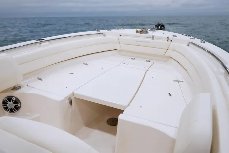  Yacht Photos Pics 2024 Grady-White Fisherman 236 boat interior with cushioned seating and ocean view.