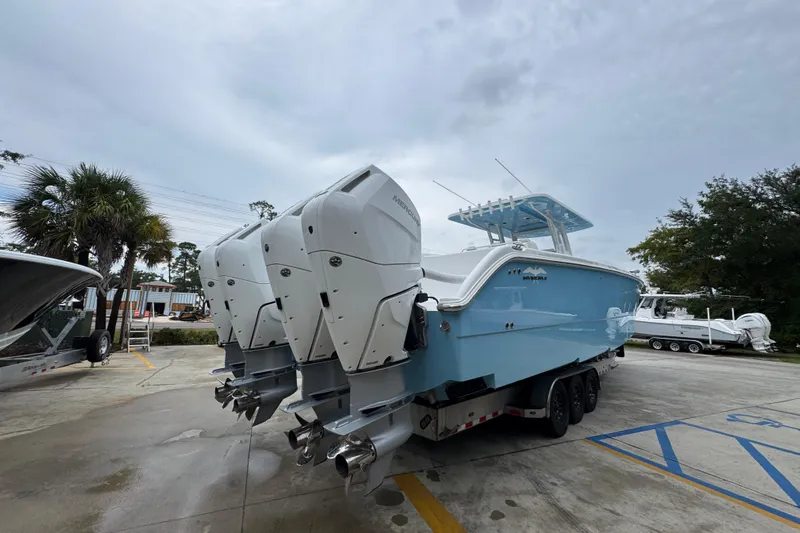  Yacht Photos Pics 2025 Invincible 40 Catamaran with triple outboard engines on a trailer.