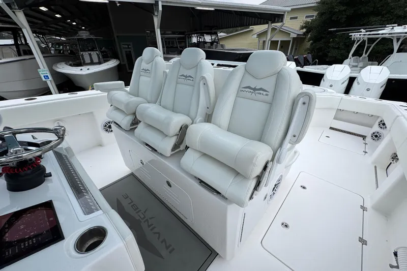  Yacht Photos Pics 2025 Invincible 40 Catamaran interior with luxurious seating and modern helm controls.
