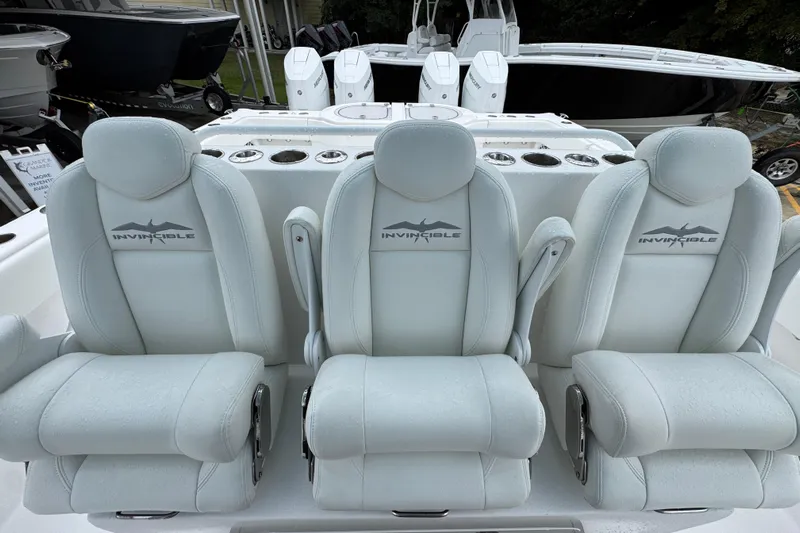  Yacht Photos Pics Luxurious seating on 2025 Invincible 40 Catamaran, featuring premium white upholstery.