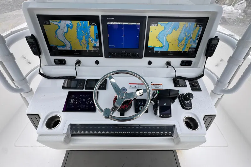  Yacht Photos Pics 2025 Invincible 40 Catamaran helm with advanced navigation displays and controls.
