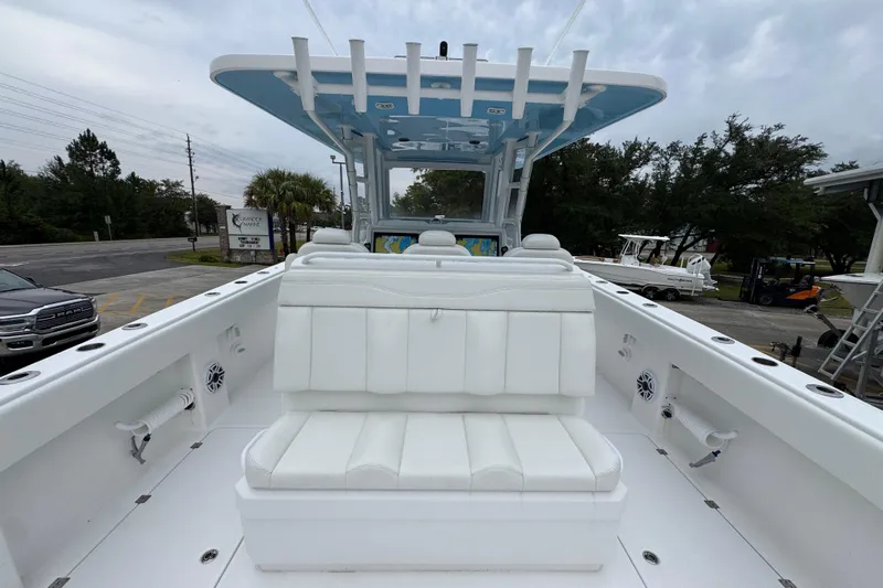  Yacht Photos Pics 2025 Invincible 40 Catamaran with white seating and spacious deck.