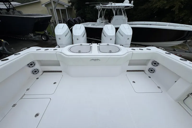  Yacht Photos Pics 2025 Invincible 40 Catamaran with Mercury engines, spacious deck, and modern design.