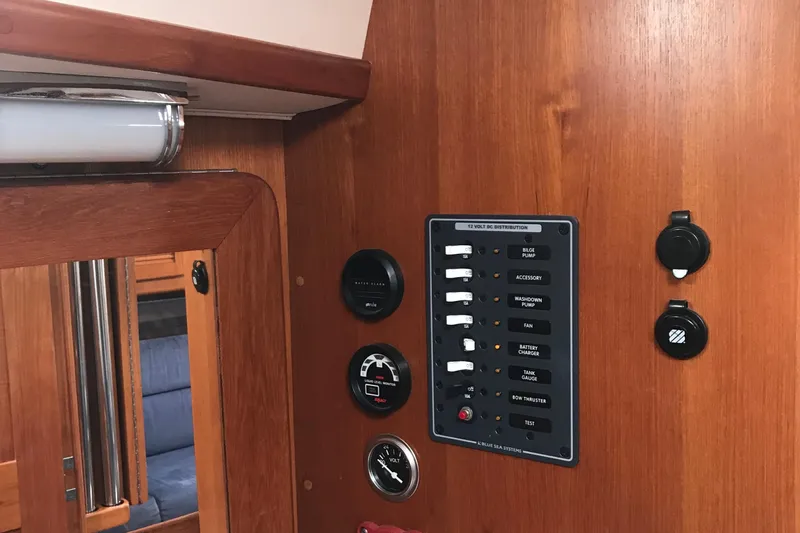 Mer Du Jour Yacht Photos Pics Control panel on 2005 Caliber 40 LRC SE yacht, featuring switches and gauges.